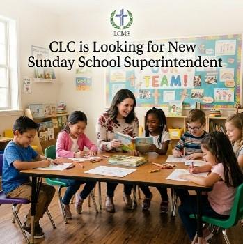 A cheerful Sunday school classroom scene shows a teacher sitting at a table with six young children who are drawing and writing. The room is decorated with colorful posters, including one that says ‘TEAM!’ Behind them, text reads ‘CLC is Looking for New Sunday School Superintendent’ with the LCMS logo featuring a cross and wreath above it.