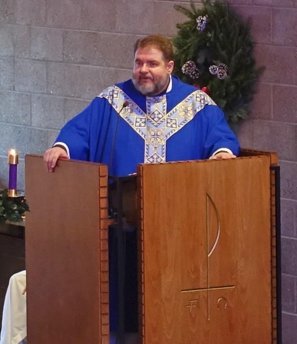 Rev. Dr. David Rowold speaking from the pulpit.